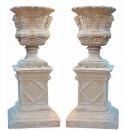 An Imposing Pair of Late 19th Century Cast Stone Borghese Urns Embellished with Bacchanalian Masks