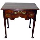 An 18th Century English Queen Anne Oak Lowboy 