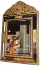  A Fine Flemish Brass Repousse and Ebonized Carved Wood Mirror