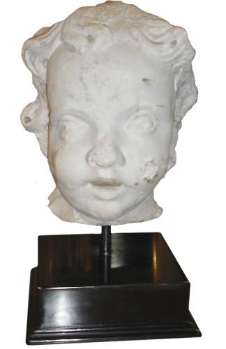 A Large Italian Lyrical Portrait of a Young Boy carved from marble