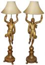 A Pair of Tuscan Gilt wood Draped Figural Torchère Floor Lamps 