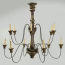 A Hand Carved Wood and Metal 12 light Chandelier with antiqued metal baluster collars and arms. Available in custom sizes and finishes; Polychrome shown M0027