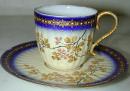 A Miniature Porcelain Cup & Saucer 