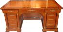 An Early 19th Century French Charles X Burlwood and Parcel Ebonized Kneehole Desk