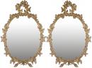 A Pair of 18th Century English Gilt Wood Oval Mirrors