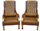 An Unusual Harlequin Pair of Italian Empire Mahogany and Parcel Gilt Arm Chairs