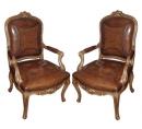 A Pair of 18th Century Italian 
Louis XV Giltwood Armchairs