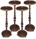A Set of Four Italian 18th Century Walnut candle stands