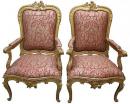 An Exceptional Pair of Roman Louis XV Giltwood Rocaille Fauteil Armchairs