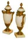 A Graceful Pair of 19th Century Ormolu-Mounted Bianco Buca Marble Urns