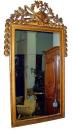 A Dramatic 18th Century French Louis XVI Carved Giltwood Mirror