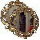A Pair of 18th Century Italian Finely Carved Round Giltwood Mirrors