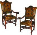 An Impressive Pair of 17th Century Italian Baroque Walnut Arm Chairs
