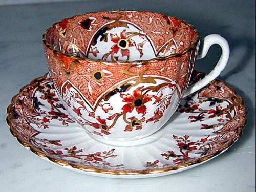 A Miniature Hand-Painted Porcelain Cup & Saucer Set  No. 1197