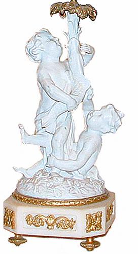 A Pair of 19th Century Bisque Putti Candlesticks No. 228