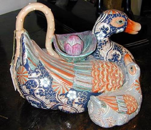 A 19th Century Imari Style Carved Porcelain Duck with Duckling No. 425